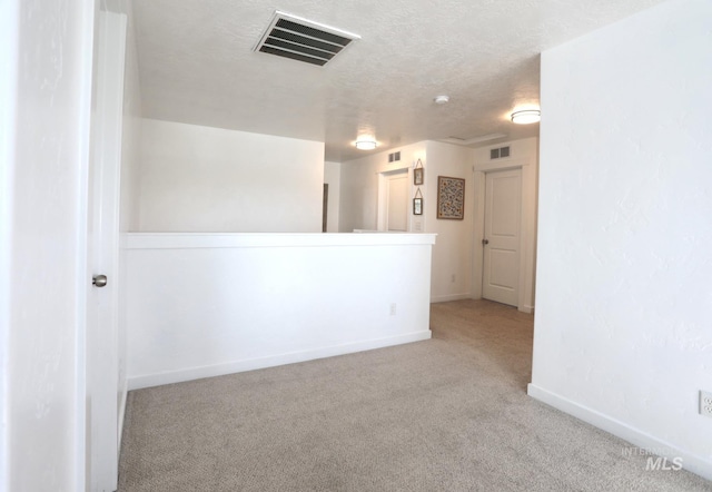 4446 S Carina Way, Meridian, ID 83642 - unfurnished room with carpet floors, baseboards, and a textured ceiling