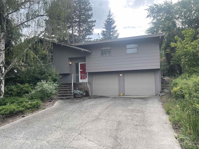 833 N Cleveland St, Moscow, ID 83843 - view of front of house with an attached garage and asphalt driveway