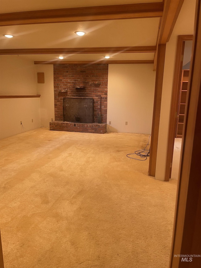 833 N Cleveland St, Moscow, ID 83843 - unfurnished living room with carpet, a brick fireplace, beamed ceiling, and recessed lighting