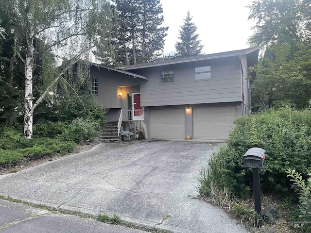 833 N Cleveland St, Moscow, ID 83843 - view of front facade featuring a garage and driveway