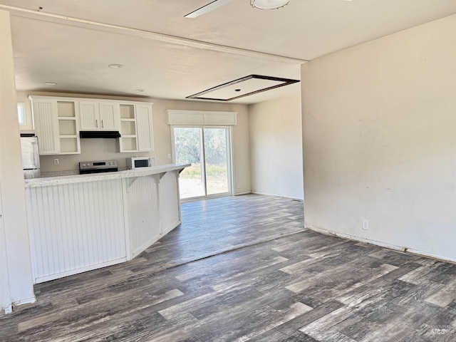 150 Sunset Dr N, Hagerman, ID 83332 - kitchen with stainless steel appliances, open shelves, dark wood-style floors, light countertops, and white cabinetry