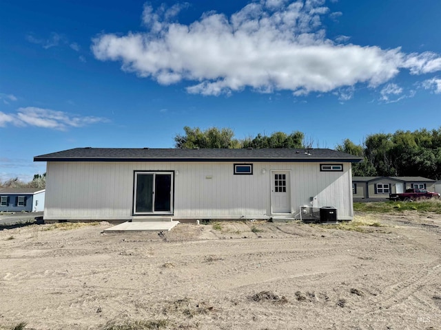 150 Sunset Dr N, Hagerman, ID 83332 - rear view of house with cooling unit and a shingled roof