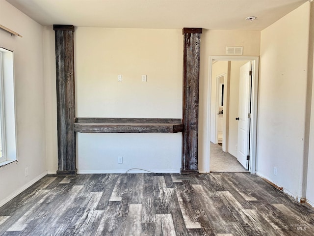 150 Sunset Dr N, Hagerman, ID 83332 - empty room featuring wood finished floors, baseboards, and ornate columns