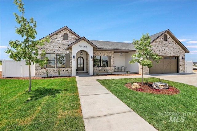 968 Gregory Way, Twin Falls, ID 83301 - french country inspired facade with an attached garage, a front yard, driveway, and a porch