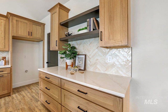 968 Gregory Way, Twin Falls, ID 83301 - kitchen with tasteful backsplash, open shelves, light stone counters, light wood-style floors, and vaulted ceiling