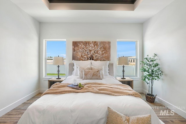 968 Gregory Way, Twin Falls, ID 83301 - bedroom featuring multiple windows and wood finished floors
