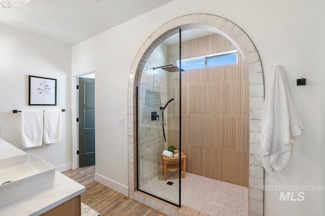 968 Gregory Way, Twin Falls, ID 83301 - full bath with wood finished floors, a walk in shower, and vanity