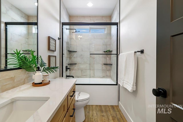 968 Gregory Way, Twin Falls, ID 83301 - full bathroom with vanity, wood finished floors, and shower / bath combination with glass door