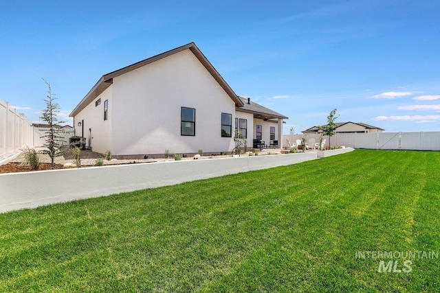 968 Gregory Way, Twin Falls, ID 83301 - rear view of property featuring a fenced backyard and stucco siding