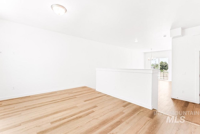 1609 N Impreza Ln Lot 24/1, Boise, ID 83713 - spare room featuring wood finished floors, a chandelier, and baseboards