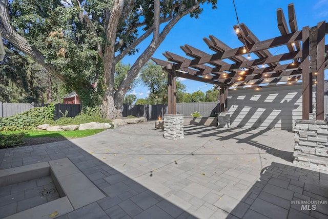 view of patio featuring a fenced backyard and a pergola