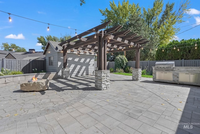 view of patio with a fenced backyard, a fire pit, area for grilling, and a pergola