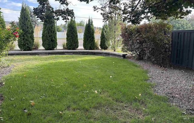 view of yard with fence