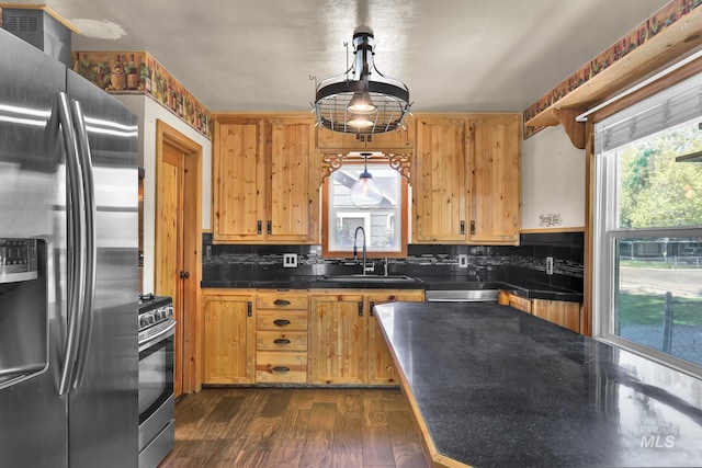 1219 N Indiana, Caldwell, ID 83605 - kitchen with open shelves, decorative backsplash, dark countertops, a sink, and stainless steel appliances