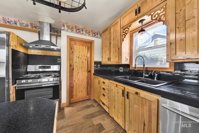 1219 N Indiana, Caldwell, ID 83605 - kitchen featuring exhaust hood, backsplash, tile countertops, a sink, and stainless steel appliances