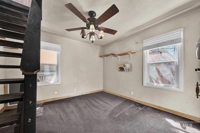 1219 N Indiana, Caldwell, ID 83605 - carpeted spare room with baseboards, visible vents, plenty of natural light, and ceiling fan