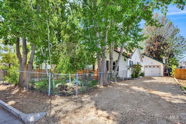 1219 N Indiana, Caldwell, ID 83605 - view of front of home featuring a garage, fence private yard, and gravel driveway