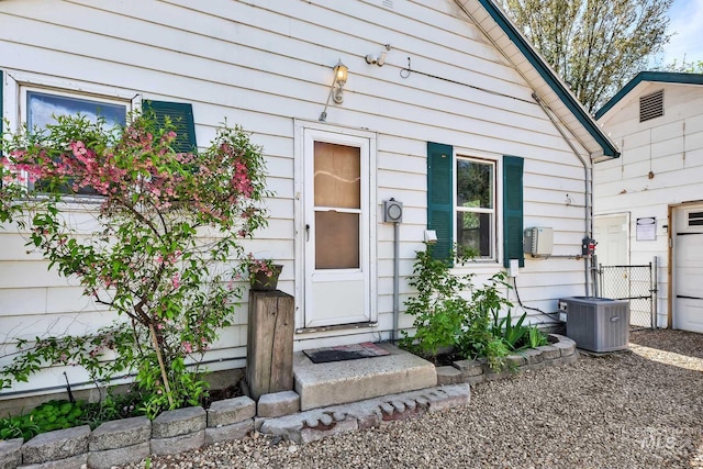 1219 N Indiana, Caldwell, ID 83605 - doorway to property featuring fence and cooling unit