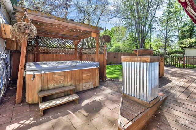 1219 N Indiana, Caldwell, ID 83605 - wooden terrace featuring a hot tub, a pergola, and a fenced backyard