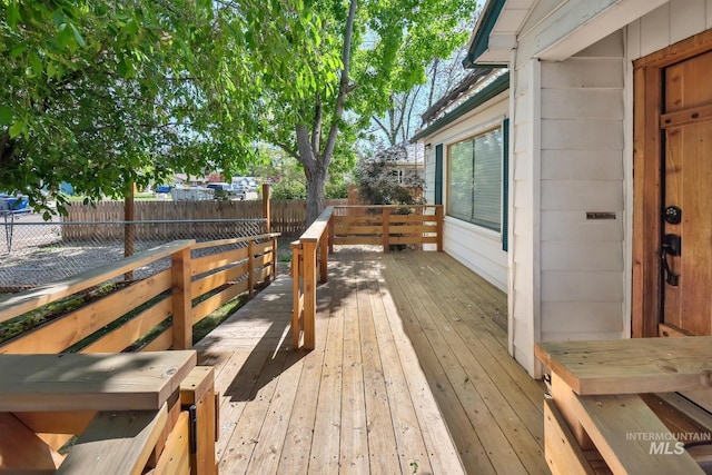 1219 N Indiana, Caldwell, ID 83605 - wooden terrace with a fenced backyard