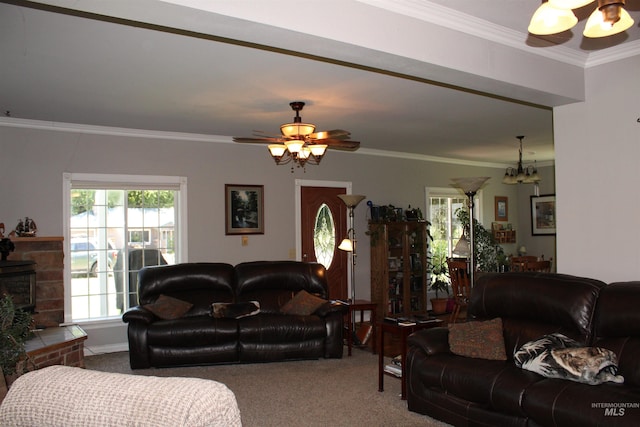 living room featuring crown molding, carpet floors, and ceiling fan with notable chandelier