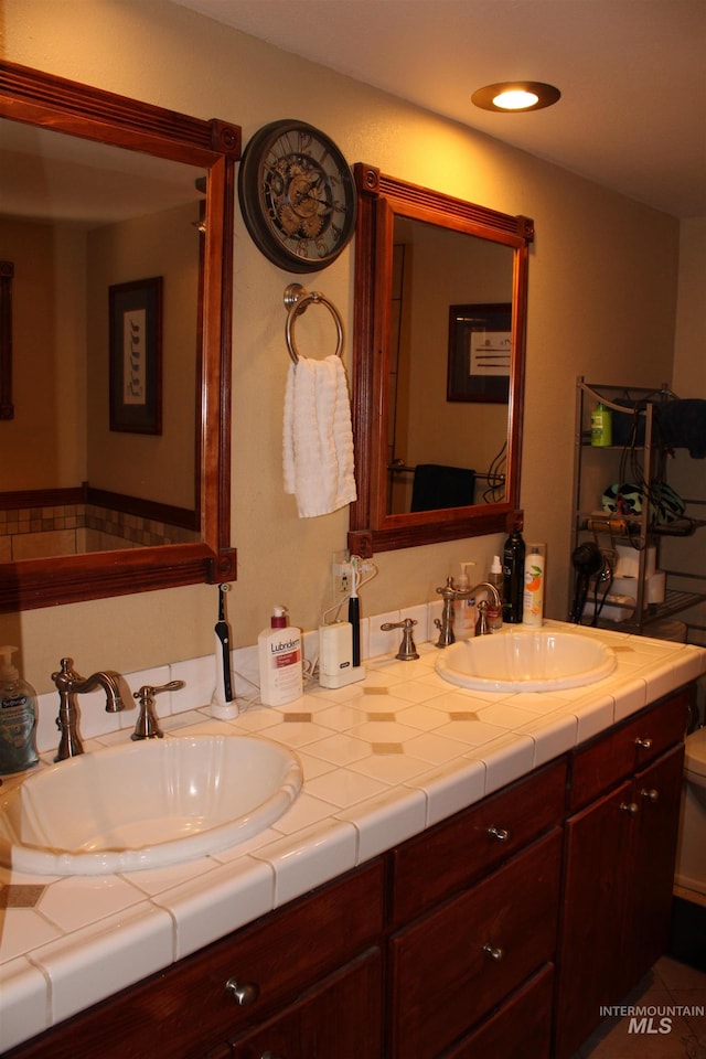 bathroom with double sink and large vanity