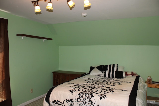 bedroom featuring ceiling fan and vaulted ceiling