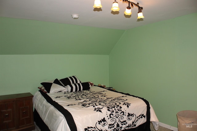 bedroom with lofted ceiling