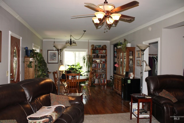 living room featuring wood-type flooring, ceiling fan, and crown molding