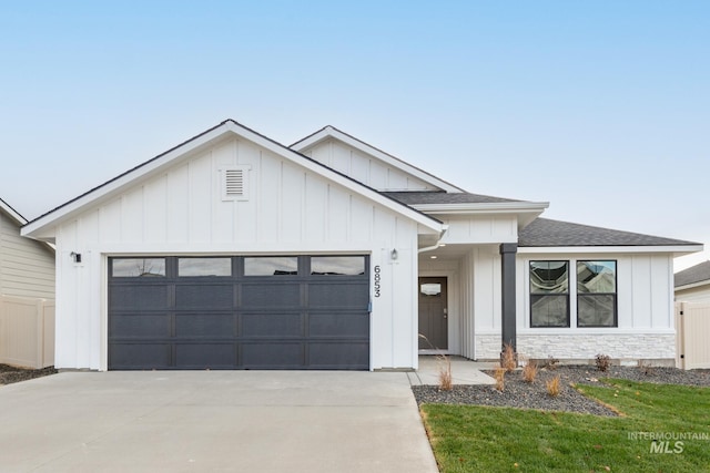 modern inspired farmhouse featuring a garage