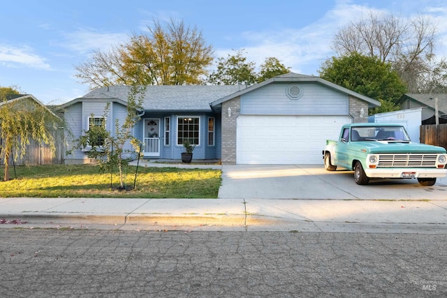 ranch-style house with a garage and a front lawn