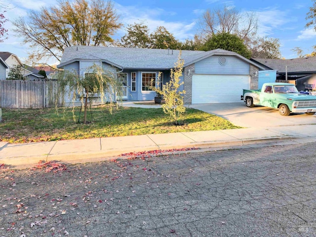 view of front of property featuring a front lawn and a garage