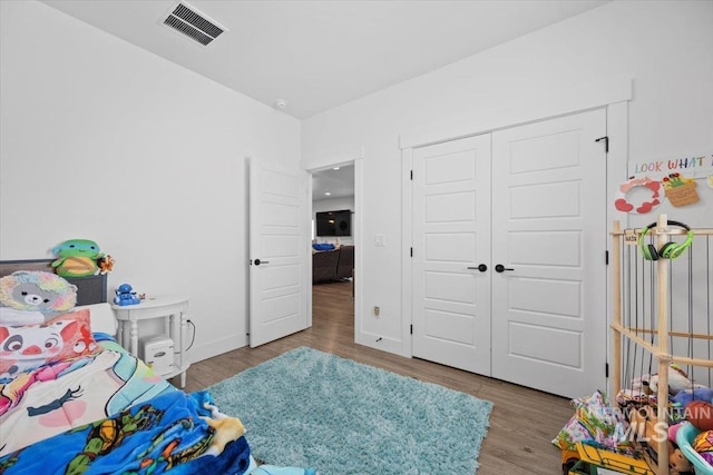 bedroom featuring a closet and light hardwood / wood-style flooring