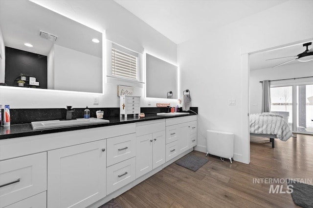 bathroom featuring vanity, hardwood / wood-style floors, and ceiling fan