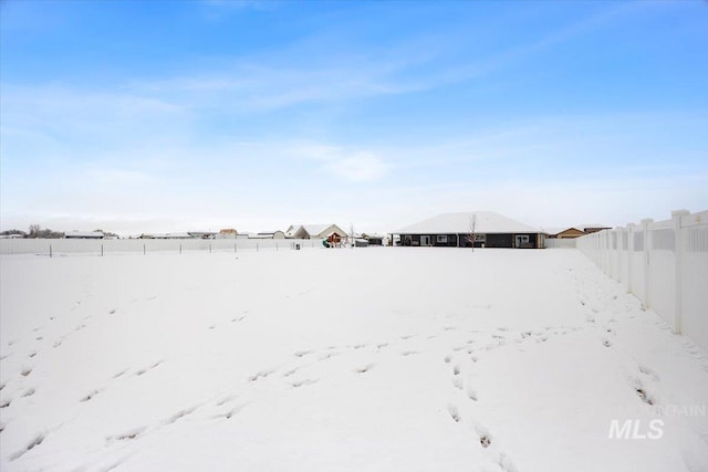 view of yard layered in snow