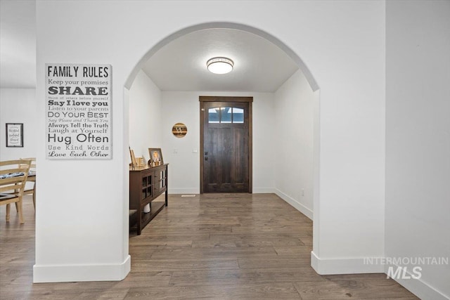 entryway with hardwood / wood-style flooring