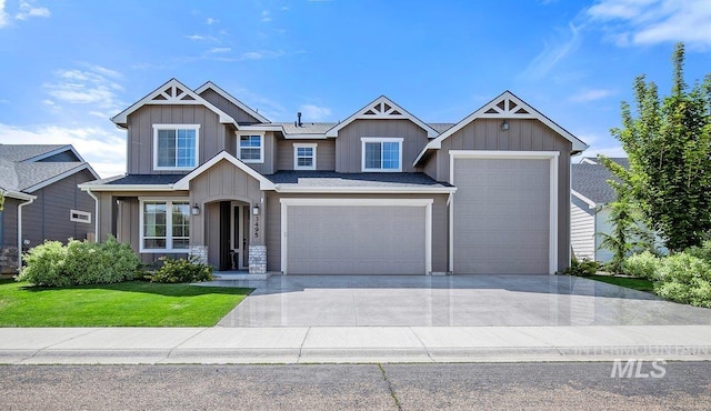 craftsman inspired home with a garage and a front yard