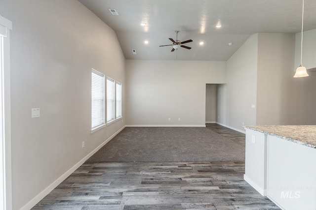 unfurnished living room with visible vents, wood finished floors, recessed lighting, baseboards, and ceiling fan