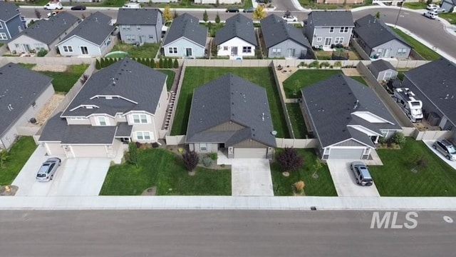 birds eye view of property with a residential view