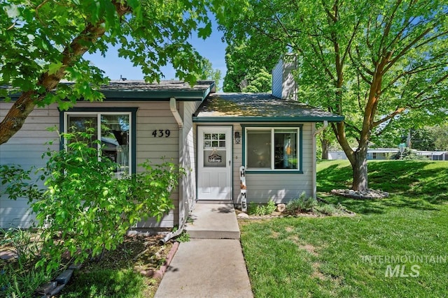 439 E Chester Ln, Boise, ID 83706 - entrance to property with a lawn and a chimney