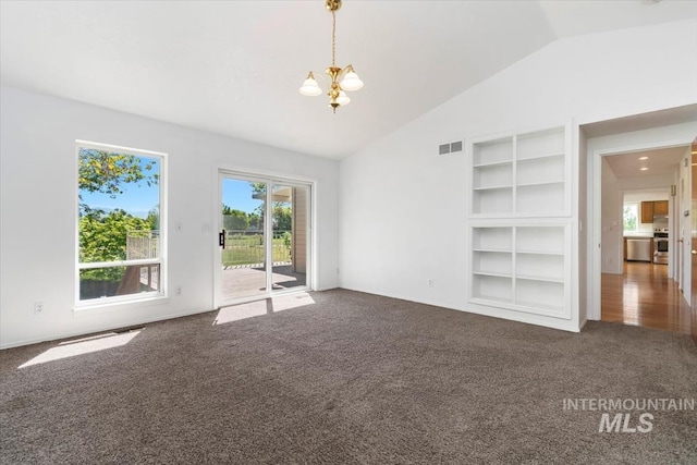 975 W Meander Ct, Eagle, ID 83616 - unfurnished living room with carpet flooring, a chandelier, lofted ceiling, and built in shelves