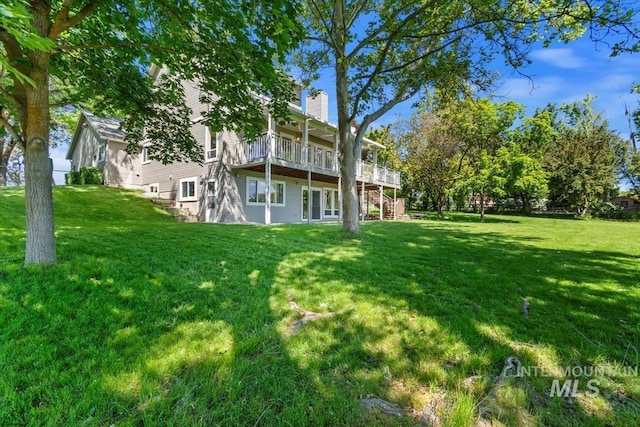975 W Meander Ct, Eagle, ID 83616 - rear view of property featuring a lawn, a wooden deck, a chimney, and stairs