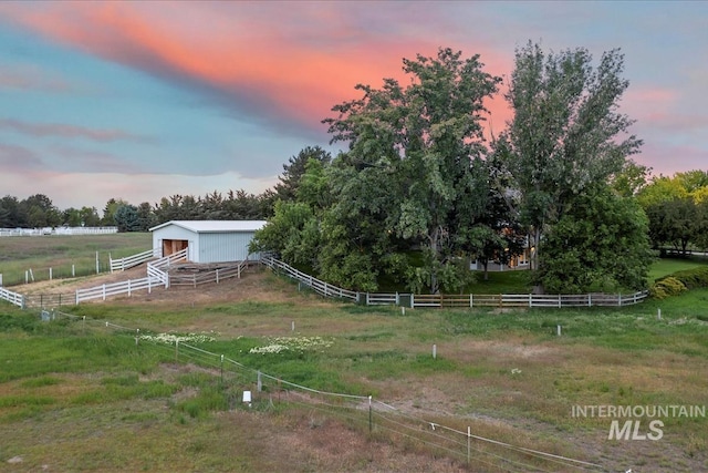 975 W Meander Ct, Eagle, ID 83616 - yard at dusk with an outbuilding, an exterior structure, and a view of countryside