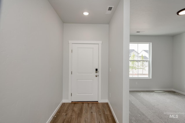 doorway to outside with hardwood / wood-style flooring