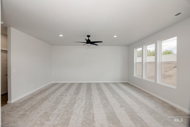 carpeted empty room with ceiling fan