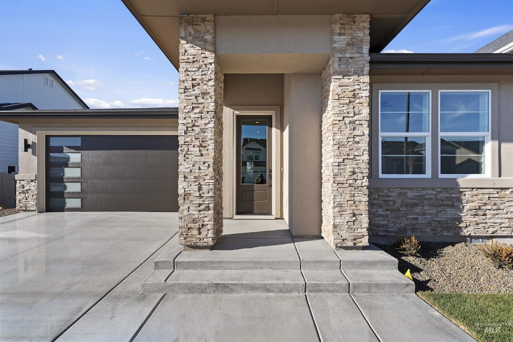 property entrance featuring a garage