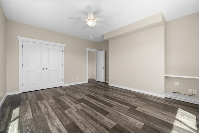 12384 S Abbott Downing Way, Nampa, ID 83686 - unfurnished bedroom with wood finished floors, baseboards, a closet, and a ceiling fan