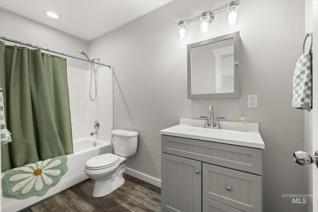12384 S Abbott Downing Way, Nampa, ID 83686 - bathroom with vanity, shower / tub combo with curtain, toilet, baseboards, and wood finished floors