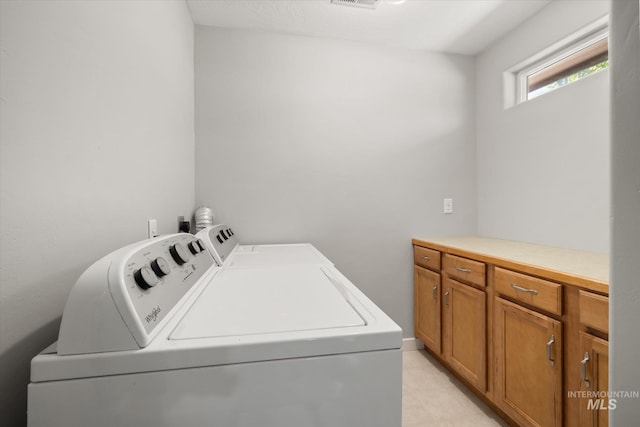12384 S Abbott Downing Way, Nampa, ID 83686 - laundry area with washing machine and dryer and cabinet space