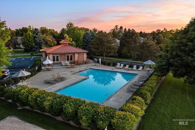 12384 S Abbott Downing Way, Nampa, ID 83686 - community pool featuring french doors and a patio area